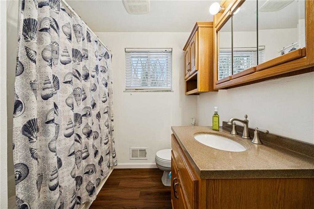910 Colonial Manor Road Irwin, PA 15642 - Photo 26 of 40 a bathroom with a sink and a mirror