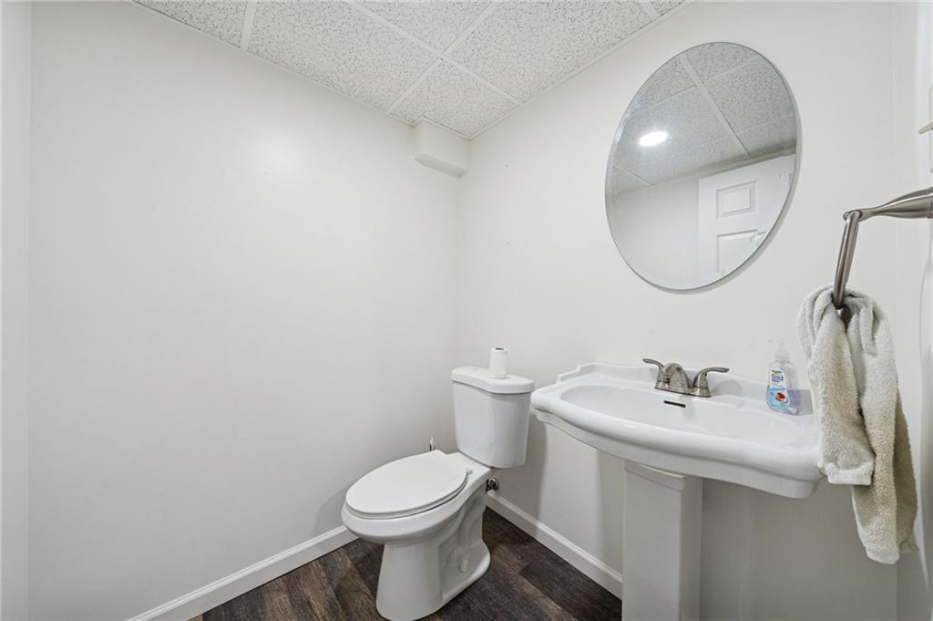 910 Colonial Manor Road Irwin, PA 15642 - Photo 30 of 40 a bathroom with a toilet sink and mirror