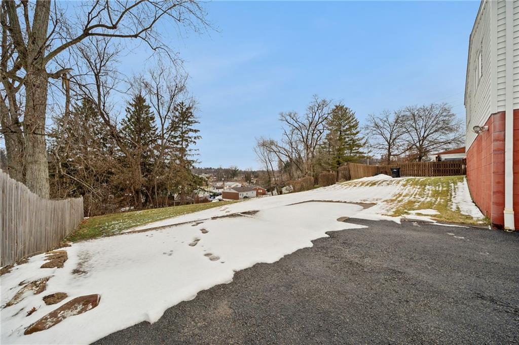910 Colonial Manor Road Irwin, PA 15642 - Photo 35 of 40 a view of a yard with a snow