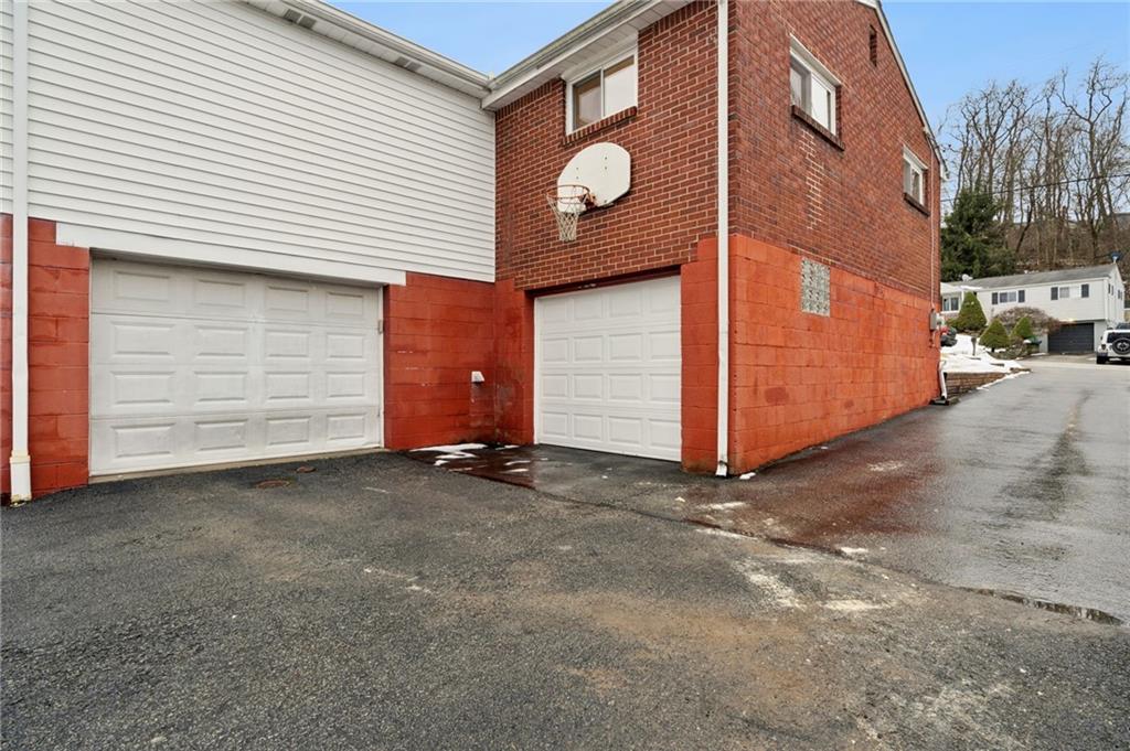 910 Colonial Manor Road Irwin, PA 15642 - Photo 36 of 40 a view of a house with a garage
