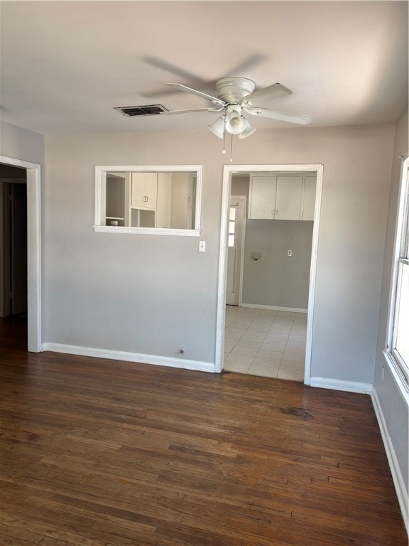 1141 Austin Street Portland, TX 78374 - Photo 3 of 10 a view of an empty room with wooden floor and a window