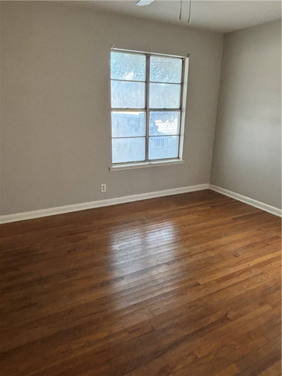 1141 Austin Street Portland, TX 78374 - Photo 4 of 10 an empty room with wooden floor and windows