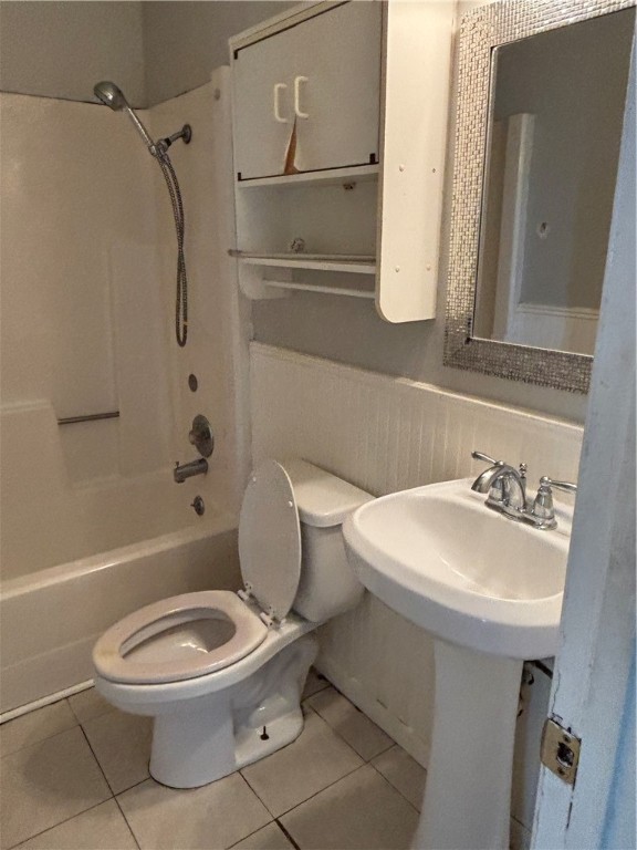 1141 Austin Street Portland, TX 78374 - Photo 8 of 10 a white toilet sitting next to a bathroom sink