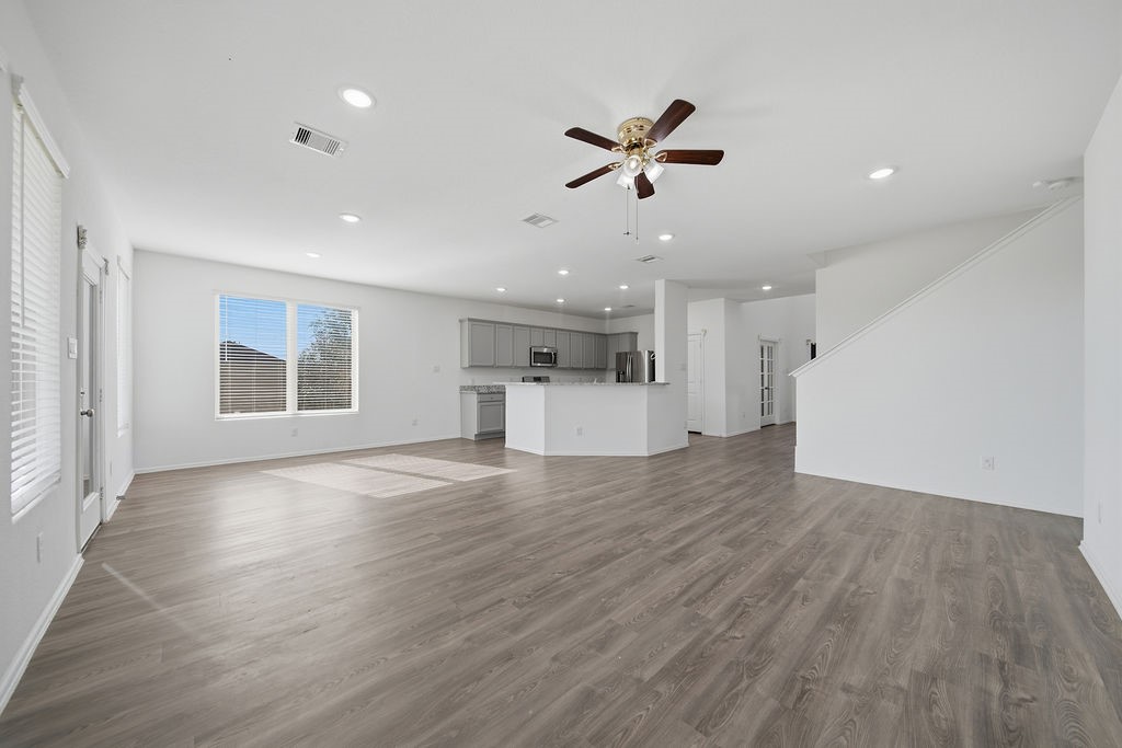 14230 Overbrook Willow Way Rosharon, TX 77583 - Photo 11 of 50 a view of empty room with wooden floor and window
