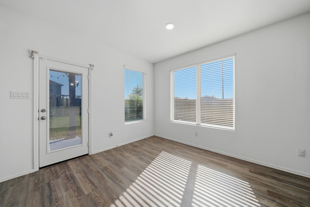 14230 Overbrook Willow Way Rosharon, TX 77583 - Photo 13 of 50 a view of an empty room with glass door and balcony