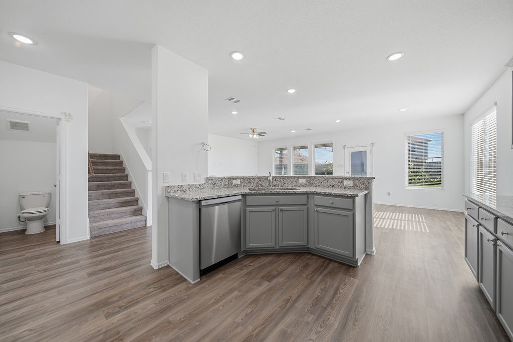 14230 Overbrook Willow Way Rosharon, TX 77583 - Photo 16 of 50 a kitchen with a sink and wooden floor