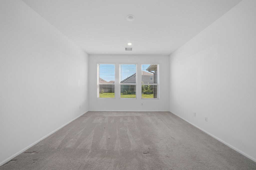 14230 Overbrook Willow Way Rosharon, TX 77583 - Photo 18 of 50 wooden floor in an empty room with a window