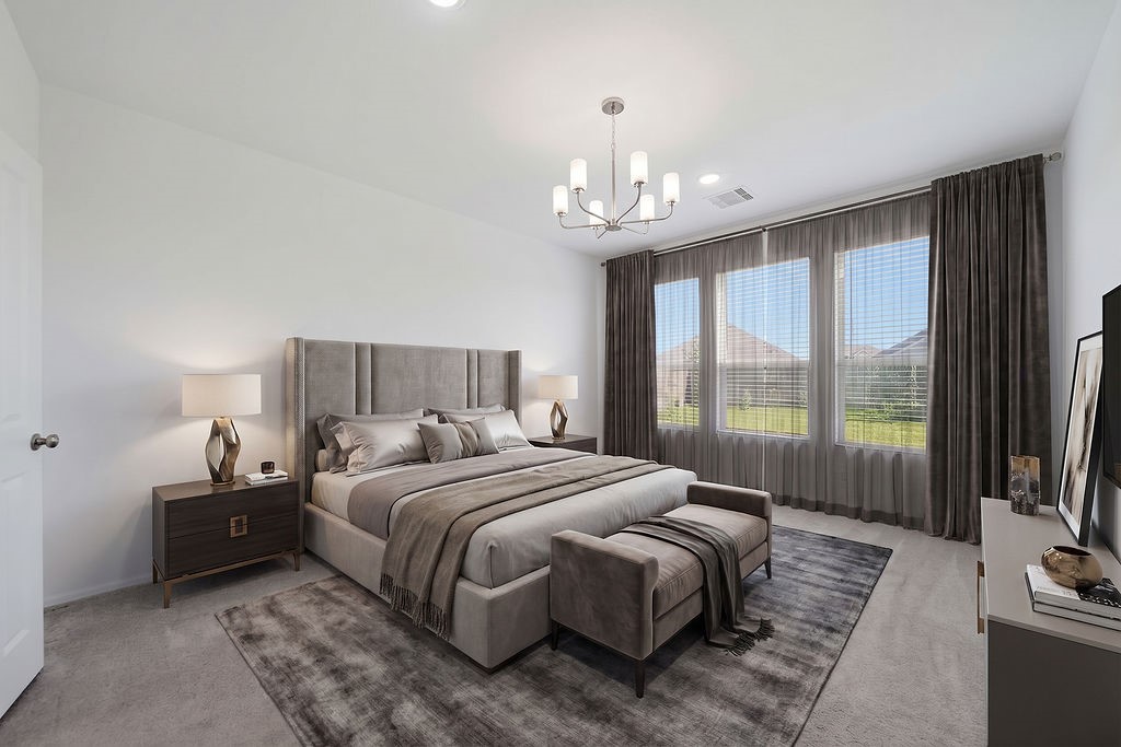 14230 Overbrook Willow Way Rosharon, TX 77583 - Photo 20 of 50 a bedroom with a bed chandelier and a large window