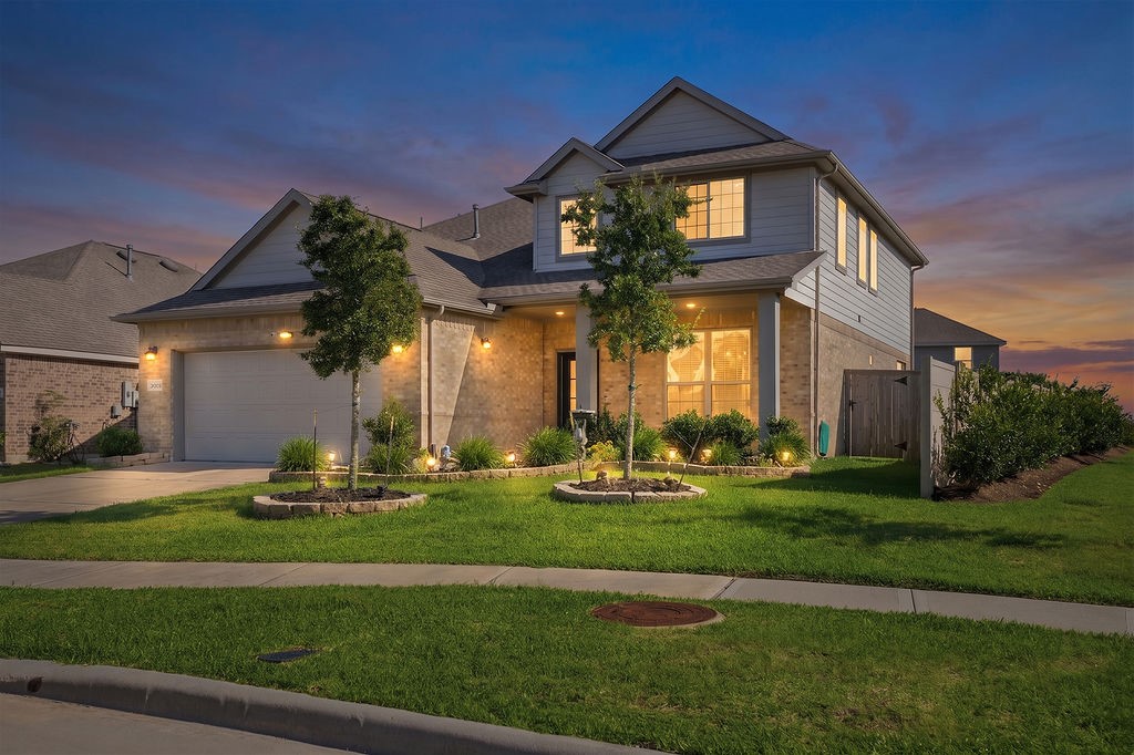 14230 Overbrook Willow Way Rosharon, TX 77583 - Photo 2 of 50 a front view of a house with a yard