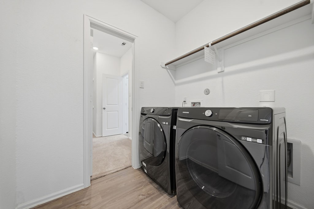 14230 Overbrook Willow Way Rosharon, TX 77583 - Photo 24 of 50 a utility room with dryer and washer