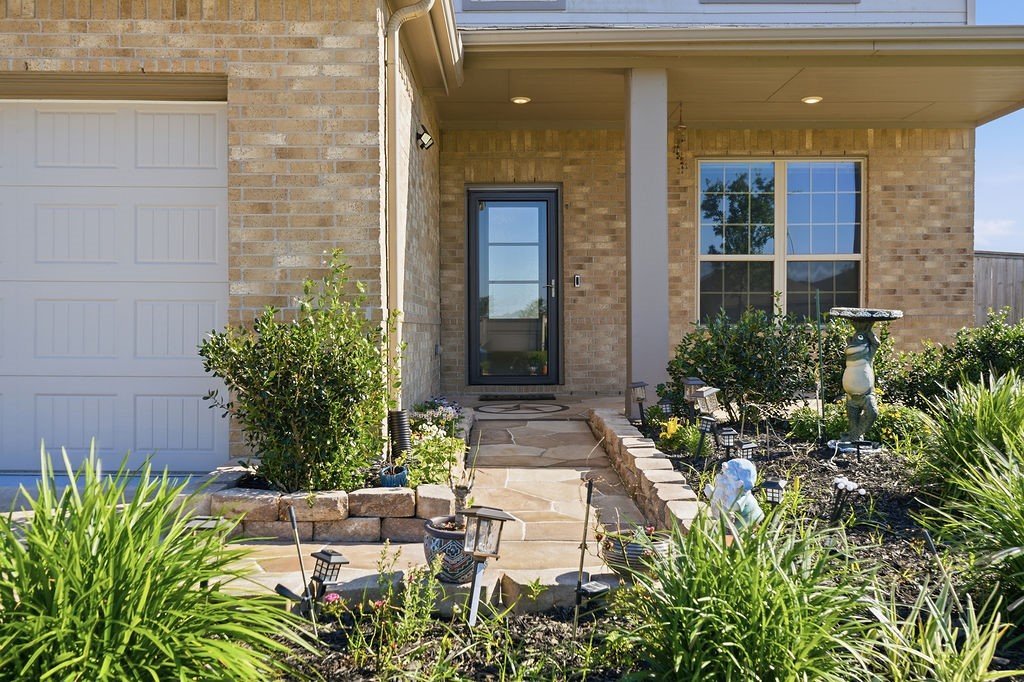 14230 Overbrook Willow Way Rosharon, TX 77583 - Photo 3 of 50 a front view of a house with a yard