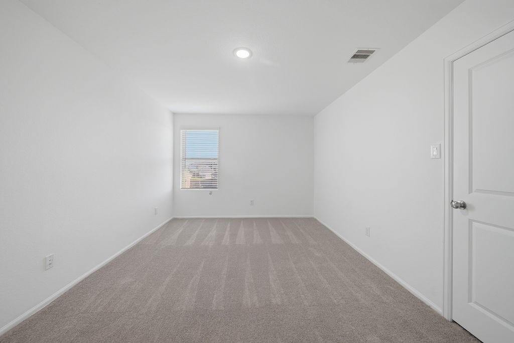 14230 Overbrook Willow Way Rosharon, TX 77583 - Photo 36 of 50 a view of an empty room with a window