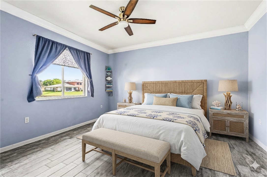 2522 Stockbridge Square Southwest Vero Beach, FL 32962 - Photo 20 of 34 a bedroom with a bed and a window