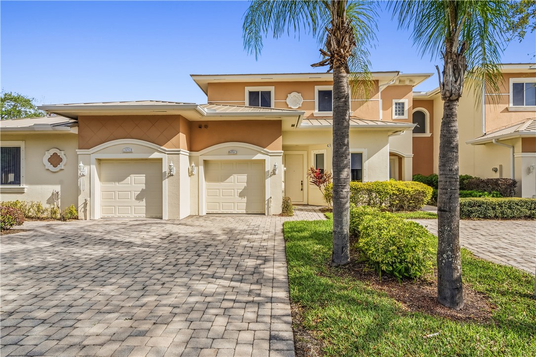 2522 Stockbridge Square Southwest Vero Beach, FL 32962 - Photo 2 of 34 a front view of a house with a yard
