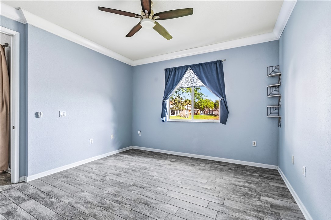 2522 Stockbridge Square Southwest Vero Beach, FL 32962 - Photo 21 of 34 a view of empty room with wooden floor