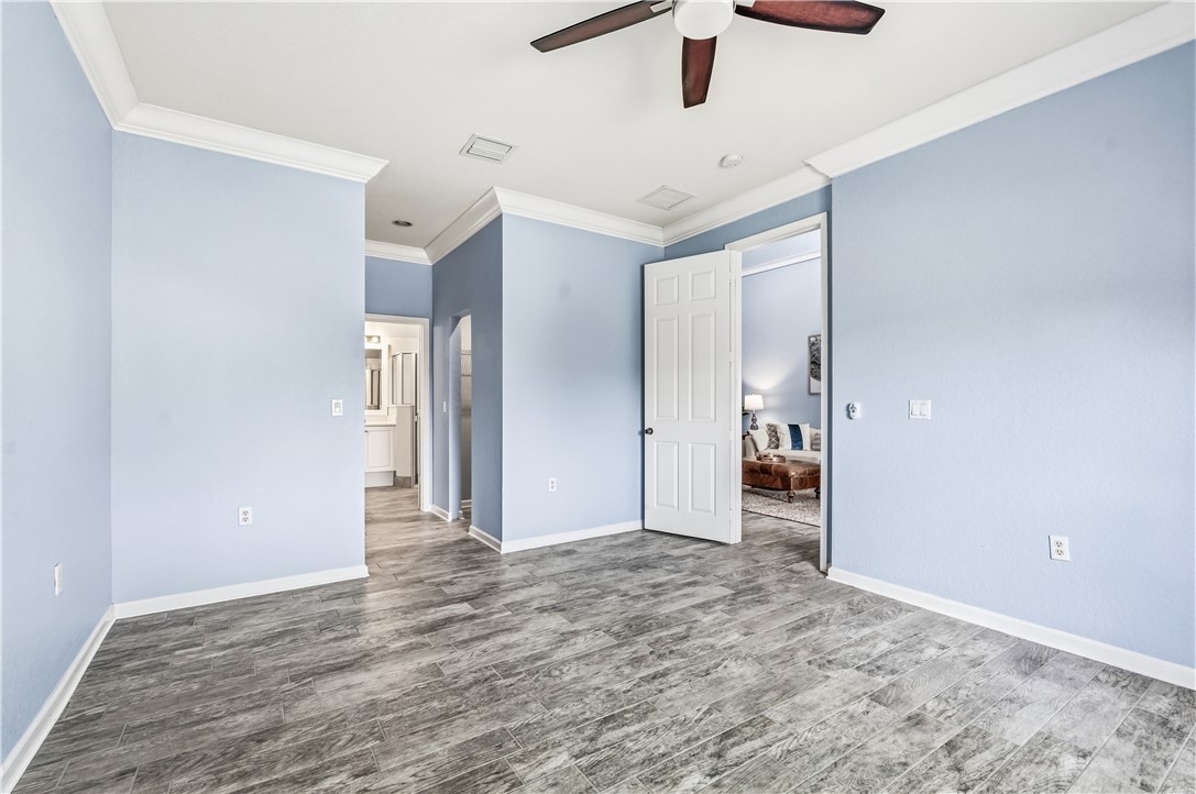2522 Stockbridge Square Southwest Vero Beach, FL 32962 - Photo 22 of 34 a view of empty room with wooden floor