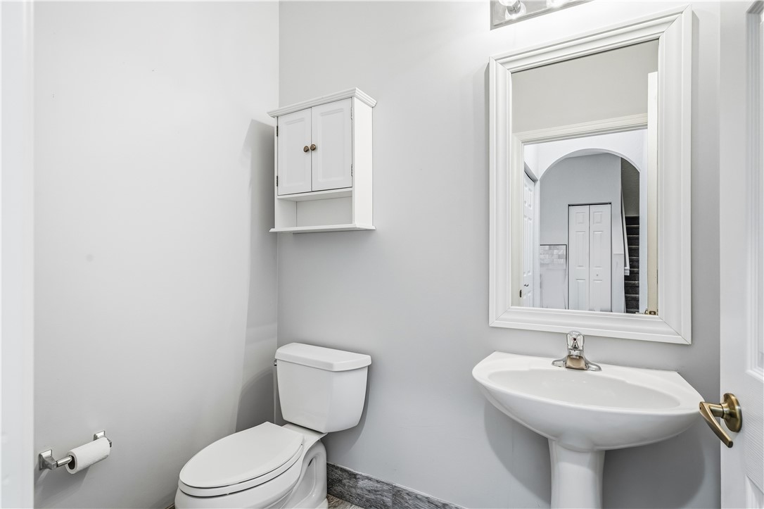 2522 Stockbridge Square Southwest Vero Beach, FL 32962 - Photo 26 of 34 a bathroom with a toilet sink and mirror