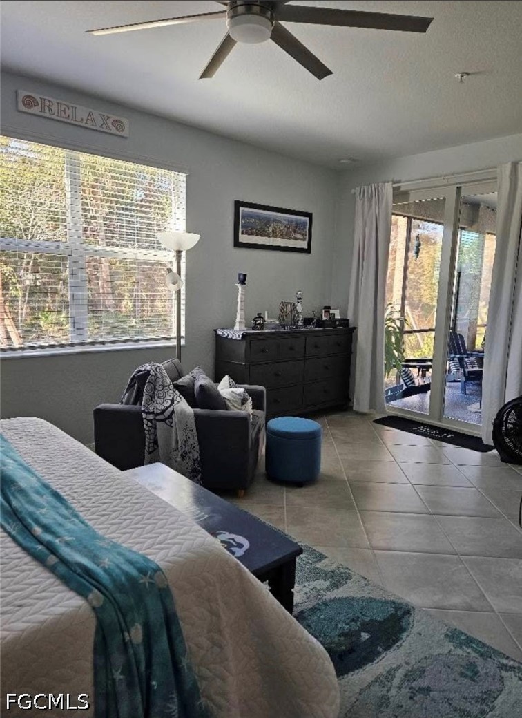 14191 Poppy Fld Loop, Unit 5312 Punta Gorda, FL 33955 - Photo 17 of 41 a bedroom with furniture and a large window