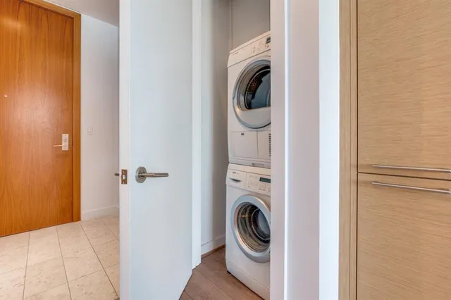 a bathroom with a granite countertop tub sink and mirror