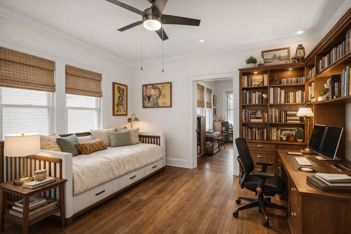 1004 Missouri Street Houston, TX 77006 - Photo 15 of 22 a bedroom with furniture and a book shelf
