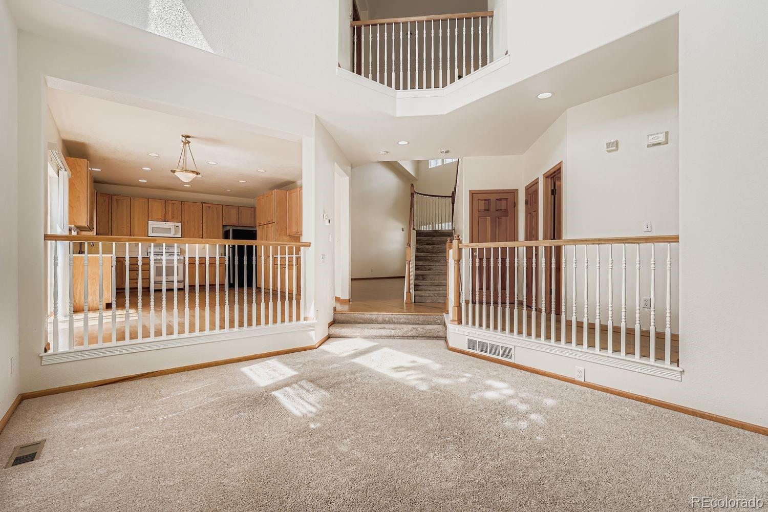 20758 East Maplewood Lane Centennial, CO 80016 - Photo 12 of 29 a view of a hallway with windows and entryway