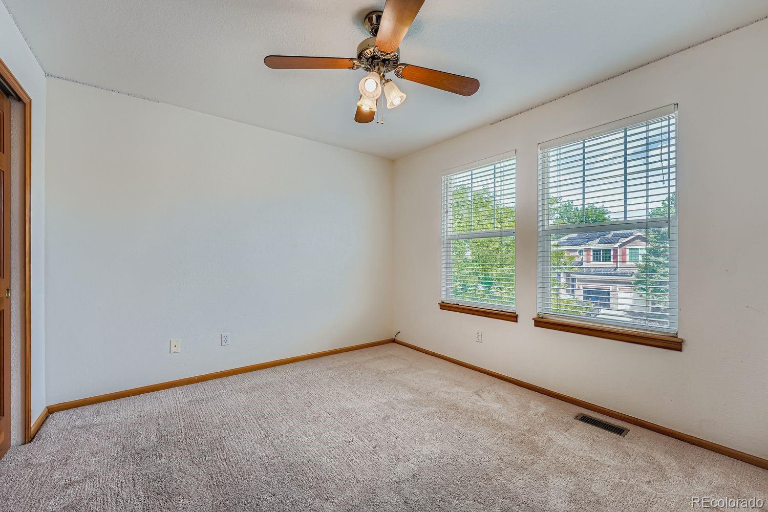 20758 East Maplewood Lane Centennial, CO 80016 - Photo 17 of 29 wooden floor in an empty room with a window