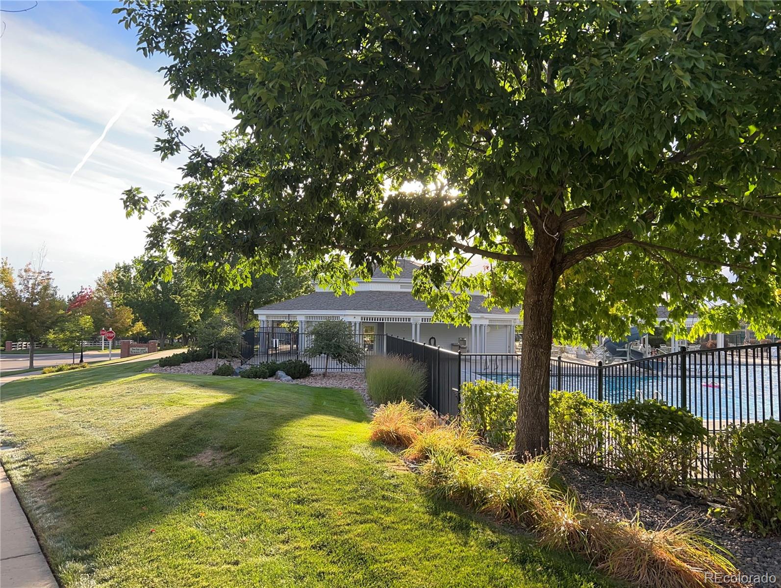 20758 East Maplewood Lane Centennial, CO 80016 - Photo 28 of 29 a view of a house with swimming pool and a yard