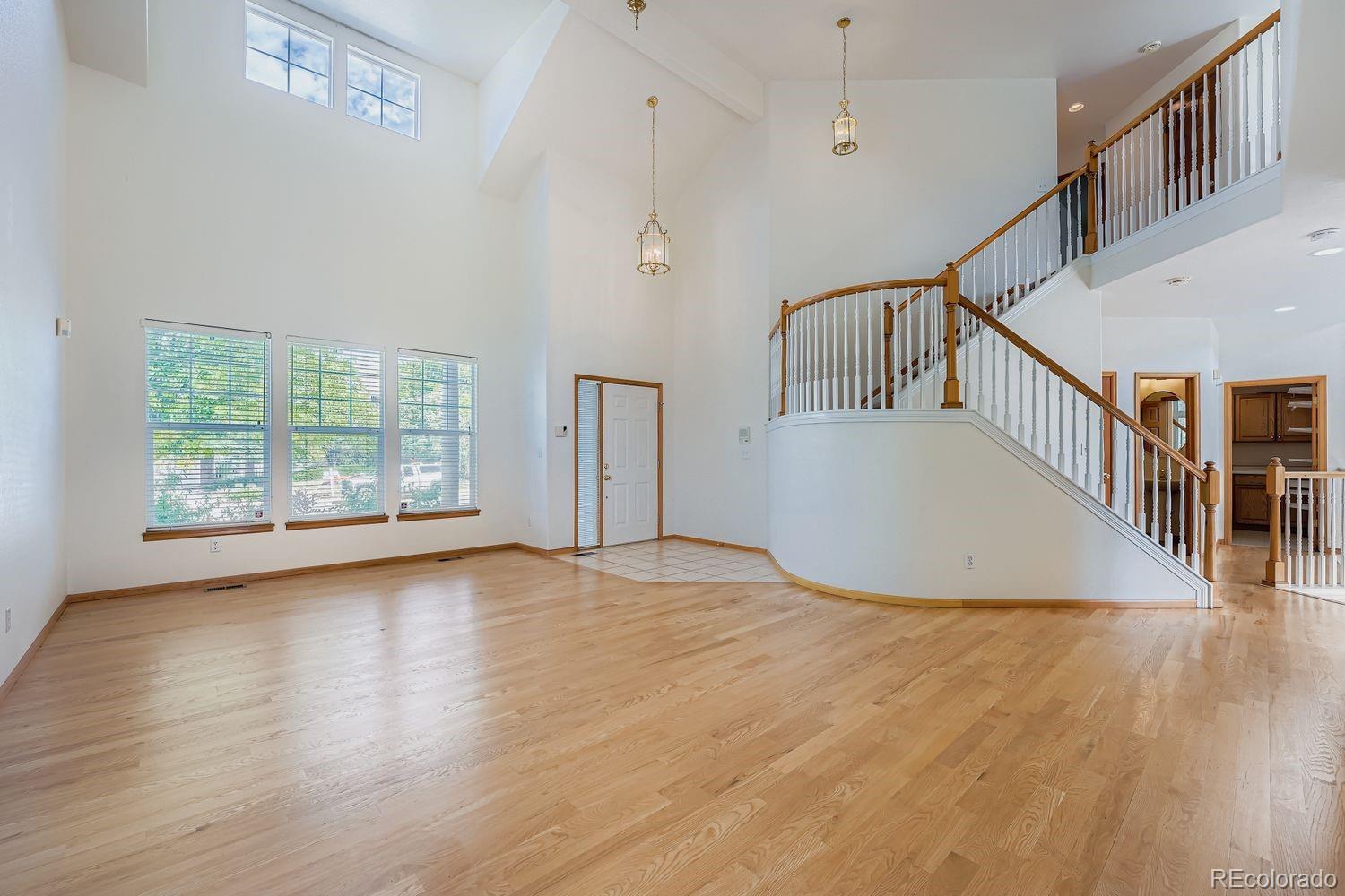 20758 East Maplewood Lane Centennial, CO 80016 - Photo 5 of 29 a view of an entryway with wooden floor