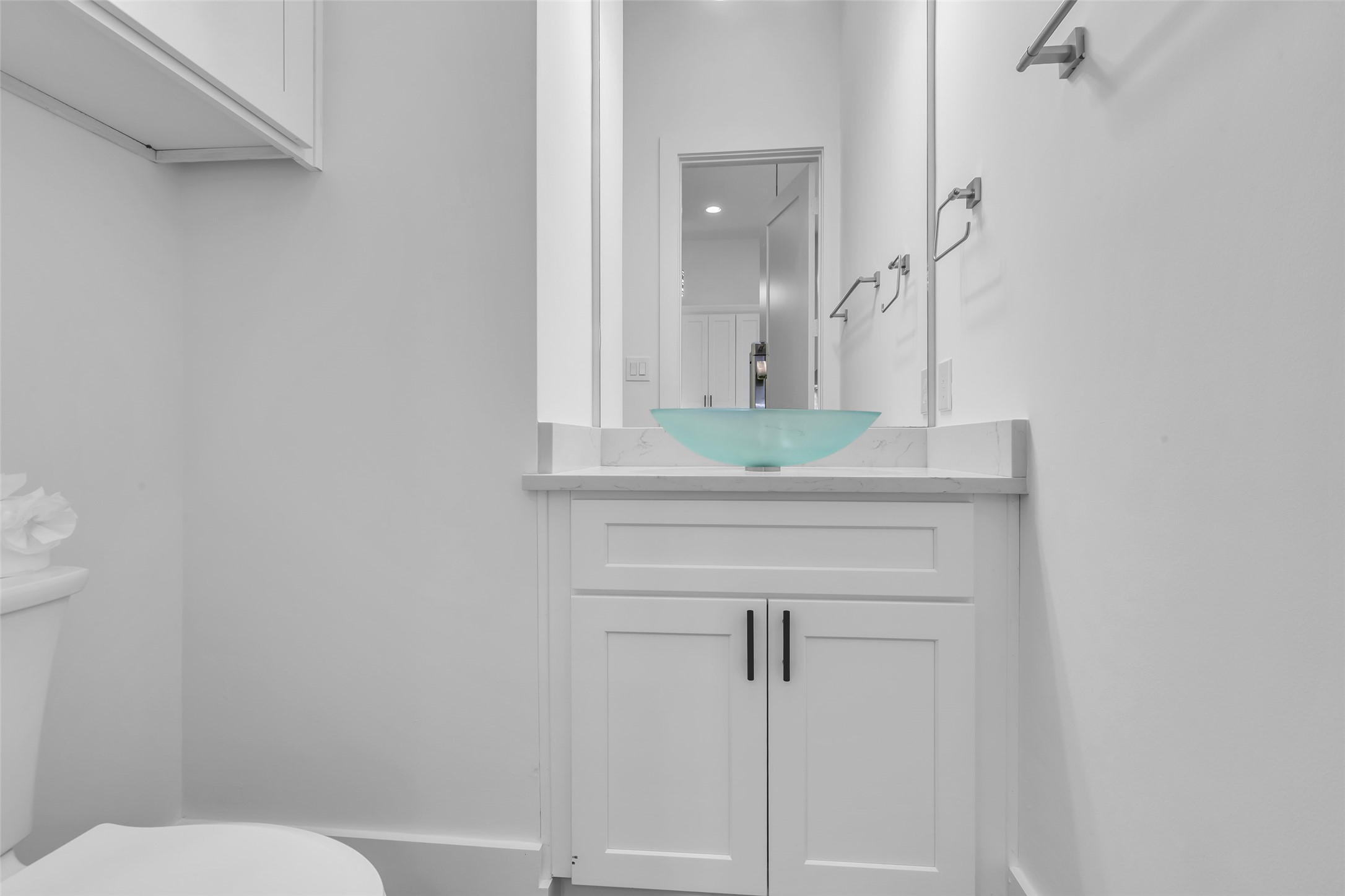 2716 Baldwin Street Houston, TX 77006 - Photo 13 of 26 The half bath on the second floor features modern fixtures and a clean, updated design for everyday convenience.