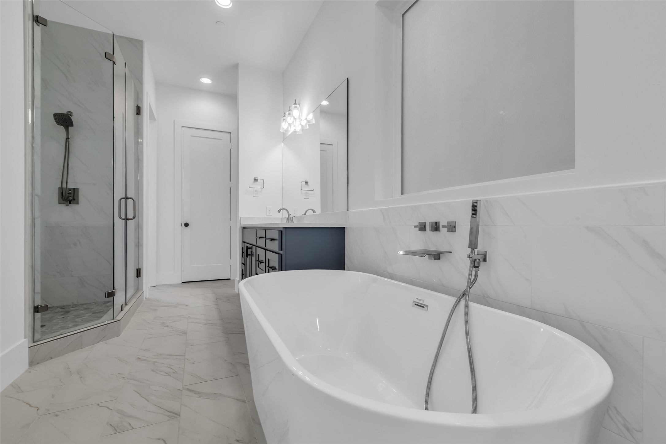 2716 Baldwin Street Houston, TX 77006 - Photo 17 of 26 Here’s a closer look at the bathtub and separate shower area, designed for comfort and everyday functionality.