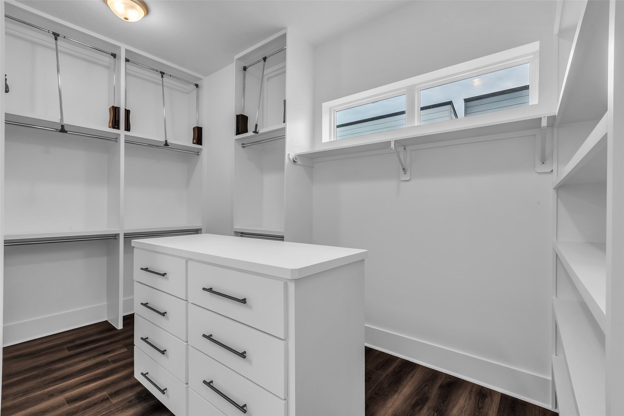 2716 Baldwin Street Houston, TX 77006 - Photo 18 of 26 The additional room in the primary bedroom includes built-in shelves, providing convenient storage for clothing and personal items.