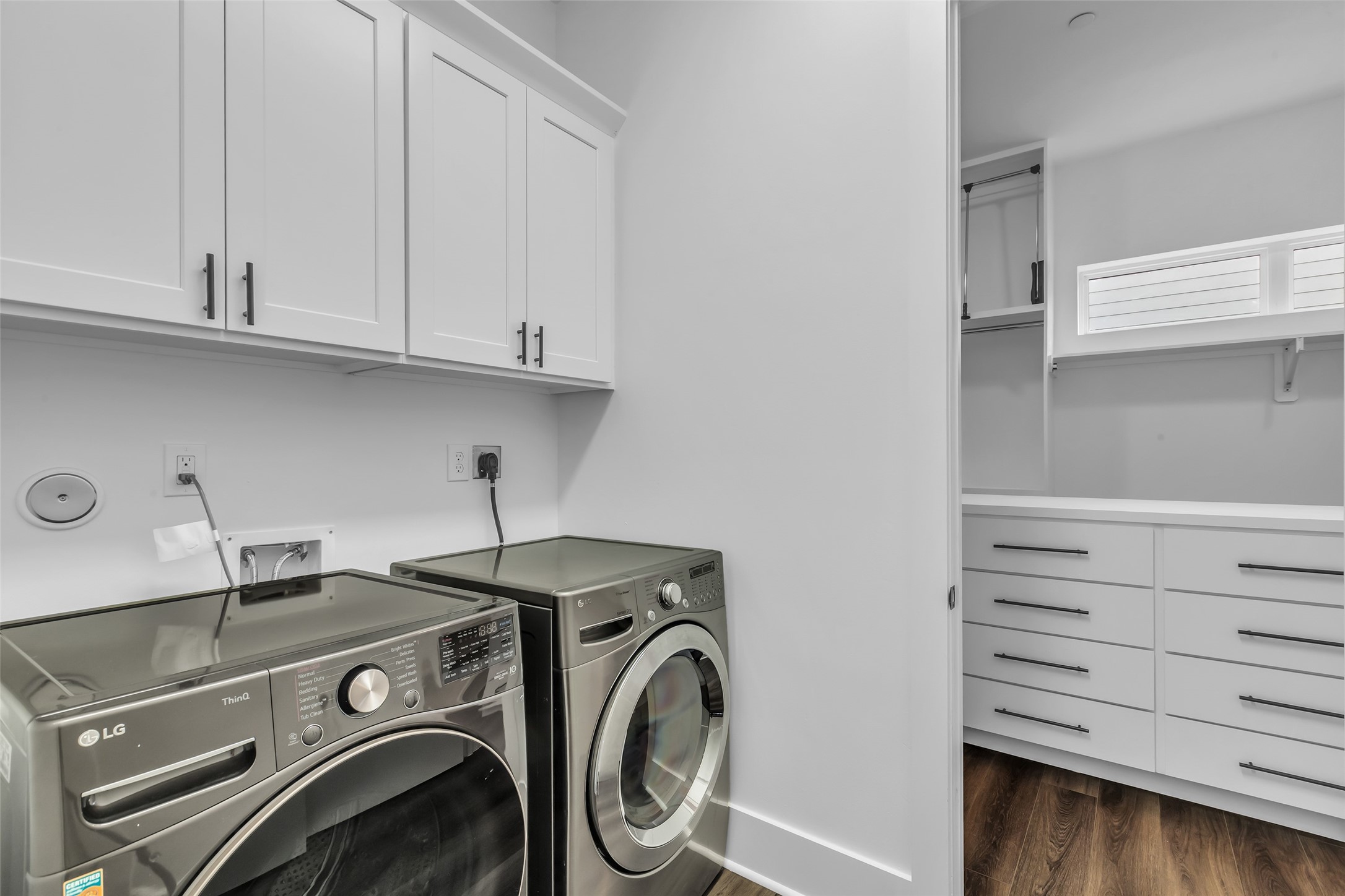 2716 Baldwin Street Houston, TX 77006 - Photo 19 of 26 Inside the laundry area, you'll find connections for an electric washer and dryer, making daily chores more manageable and efficient.