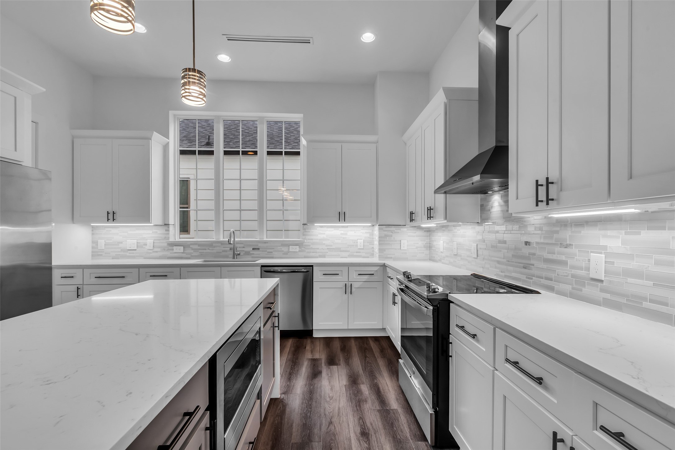 2716 Baldwin Street Houston, TX 77006 - Photo 6 of 26 It is equipped with stainless steel appliances and ample cabinet space for storage and organization.