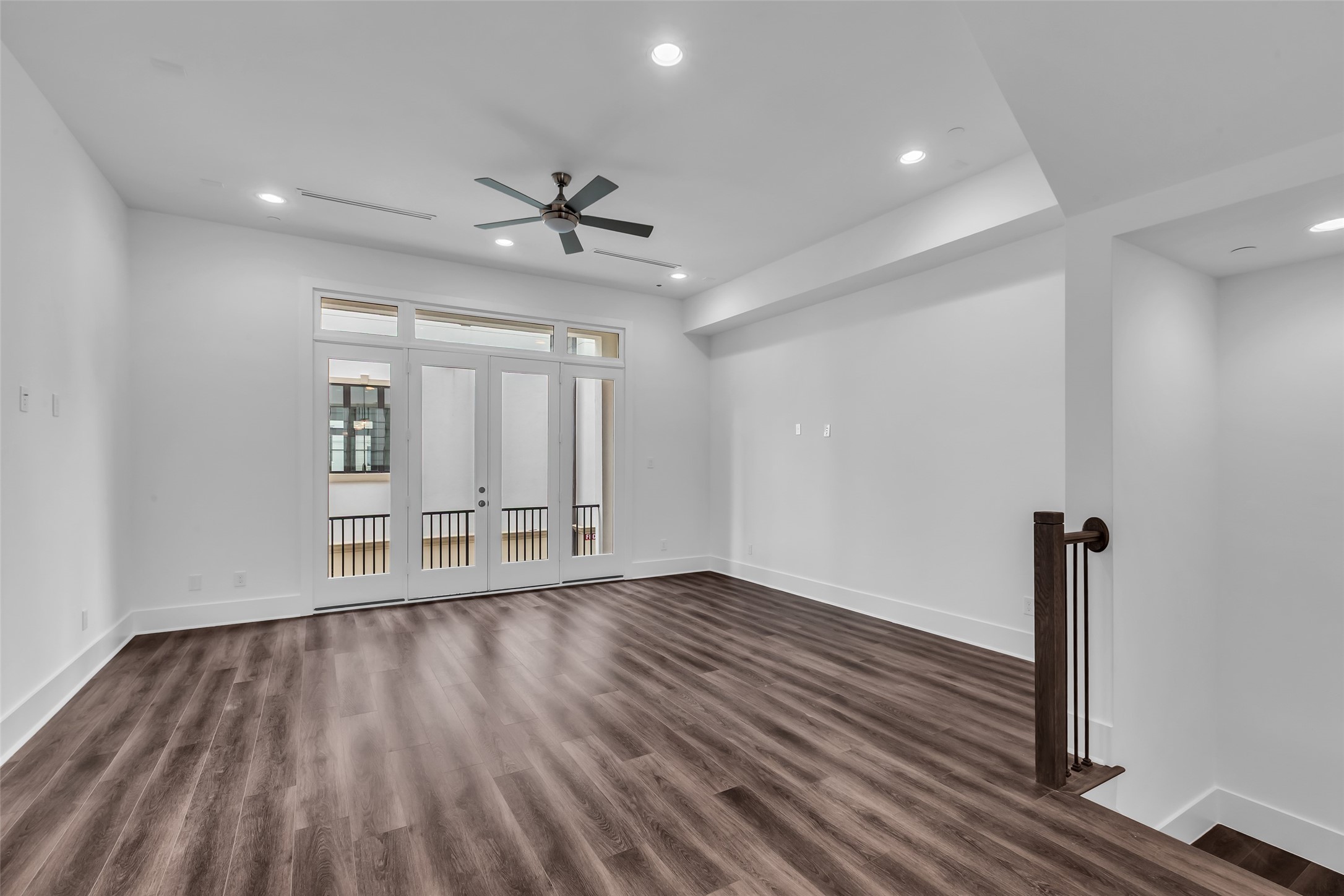 2716 Baldwin Street Houston, TX 77006 - Photo 10 of 26 This open living room connects seamlessly to the kitchen and dining area, providing a spacious layout ideal for everyday living and entertaining.
