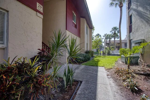 a view of backyard with swimming pool and outdoor seating