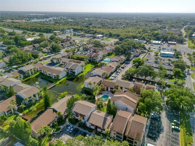 an aerial view of residential houses with outdoor space
