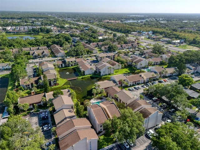 an aerial view of residential houses with outdoor space