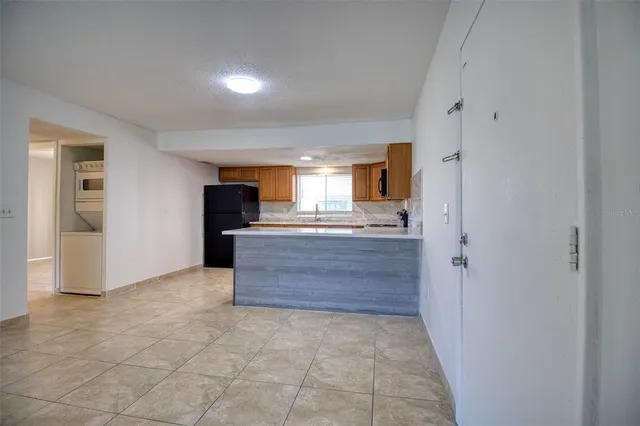 a large bathroom with a sink and a mirror