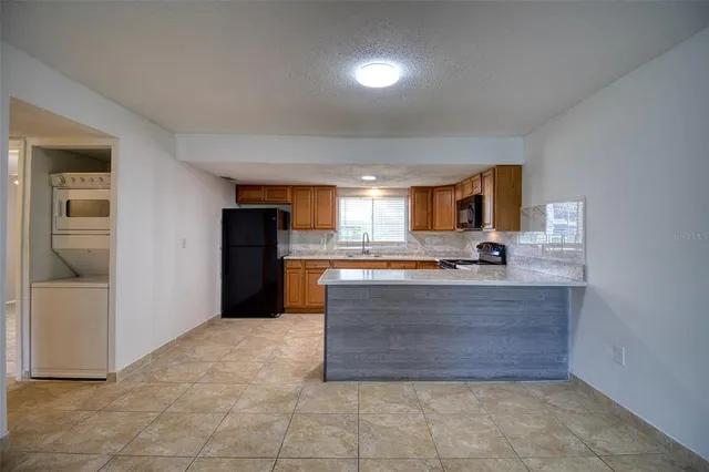 a view of living room with granite countertop furniture and fireplace