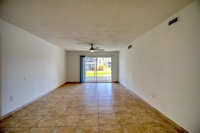 a view of hallway with wooden floor