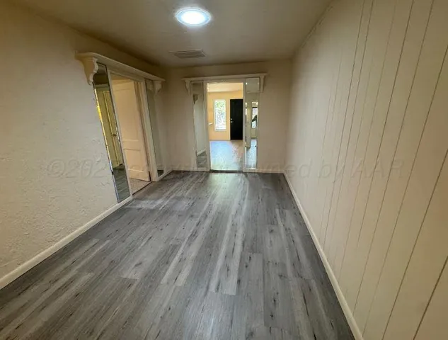 a view of wooden floor in an empty room