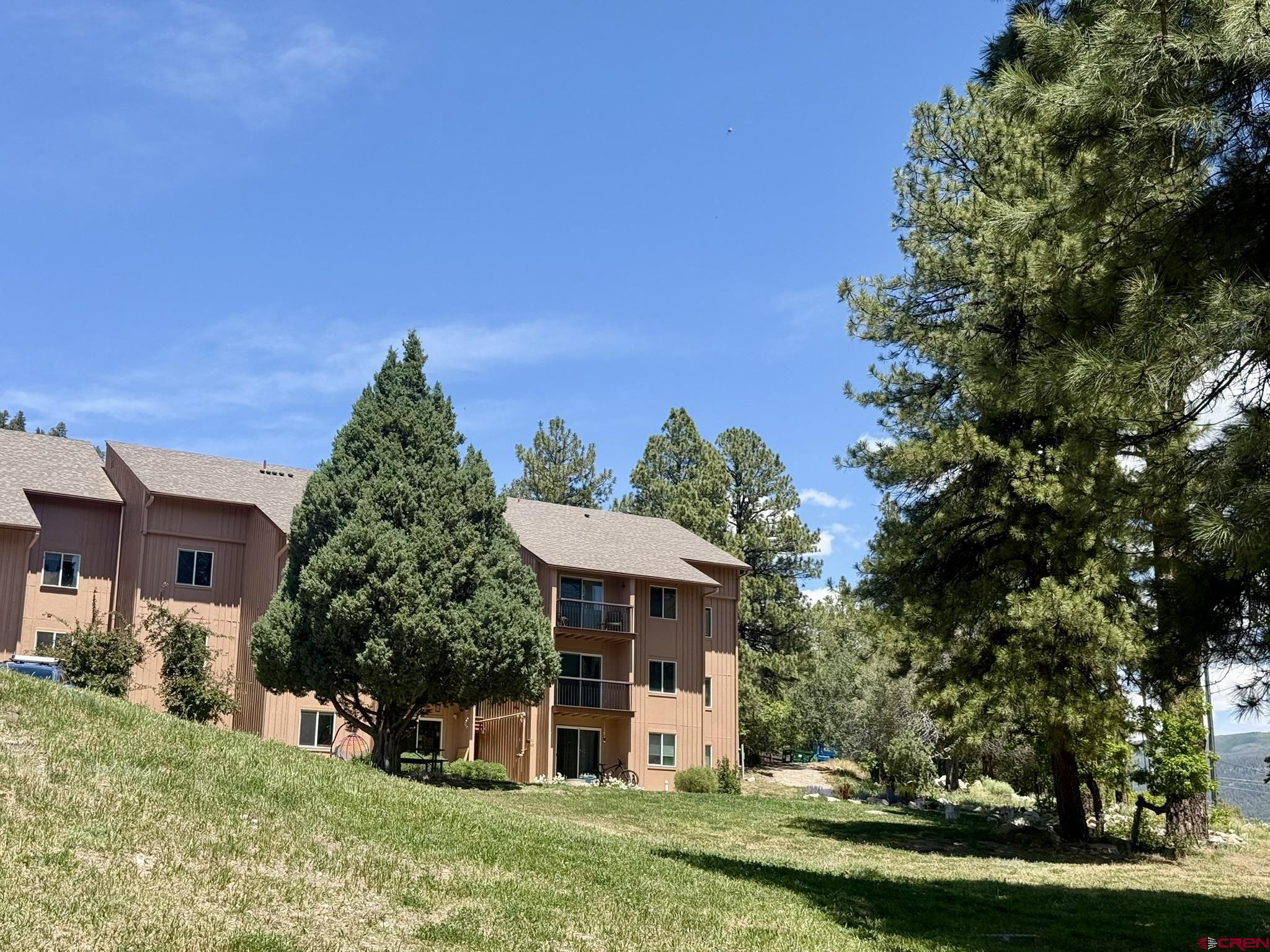 34237 Highway 550, Unit 27 Durango, CO 81301 - Photo 34 of 45 a front view of a house with a yard