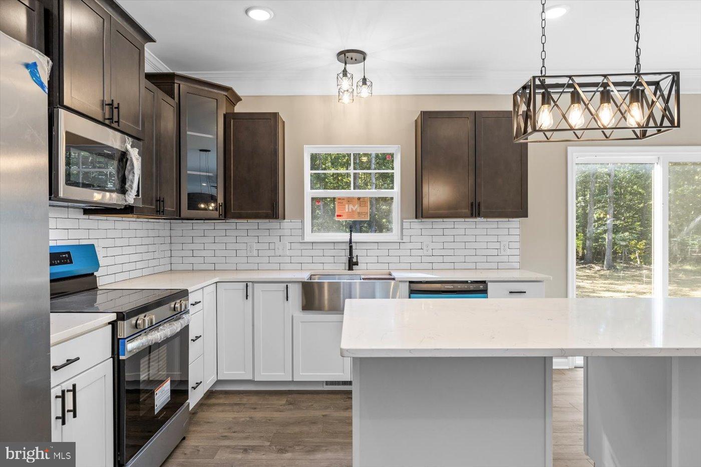 9019 Smiths Bend Road Fredericksburg, VA 22407 - Photo 16 of 57 a kitchen with stainless steel appliances a sink stove and refrigerator