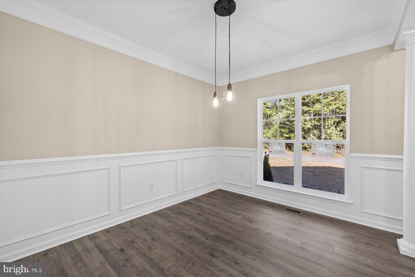 9019 Smiths Bend Road Fredericksburg, VA 22407 - Photo 19 of 57 a view of an empty room with wooden floor and a window
