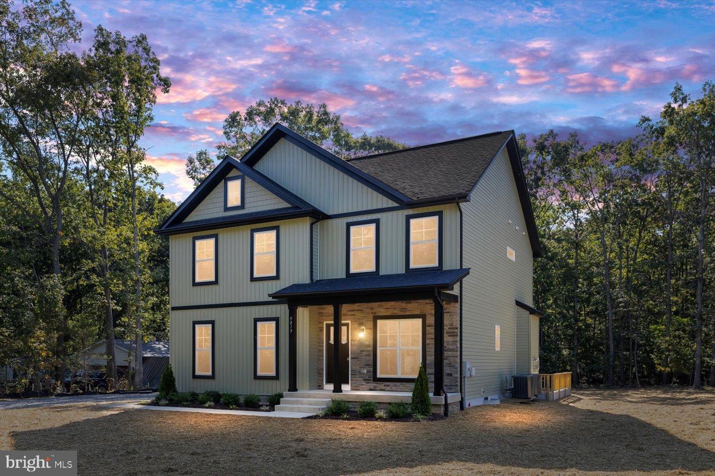 9019 Smiths Bend Road Fredericksburg, VA 22407 - Photo 2 of 57 a front view of a house with a yard