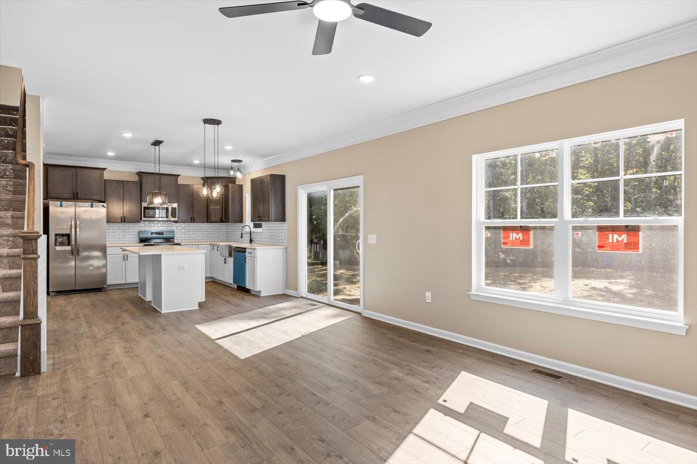 9019 Smiths Bend Road Fredericksburg, VA 22407 - Photo 27 of 57 a view of a kitchen with stainless steel appliances wooden floor and a window