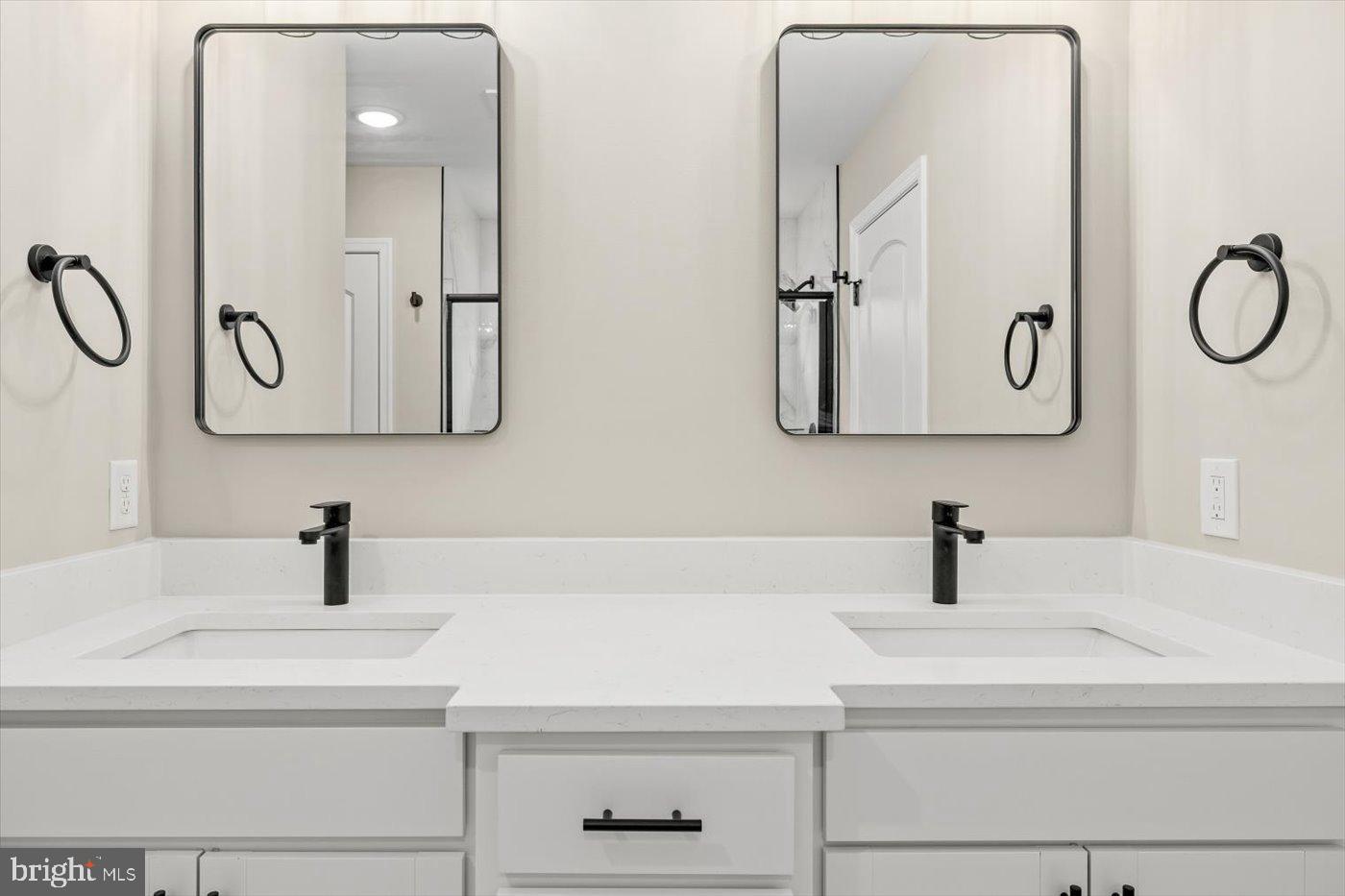 9019 Smiths Bend Road Fredericksburg, VA 22407 - Photo 37 of 57 a bathroom with a sink and mirror