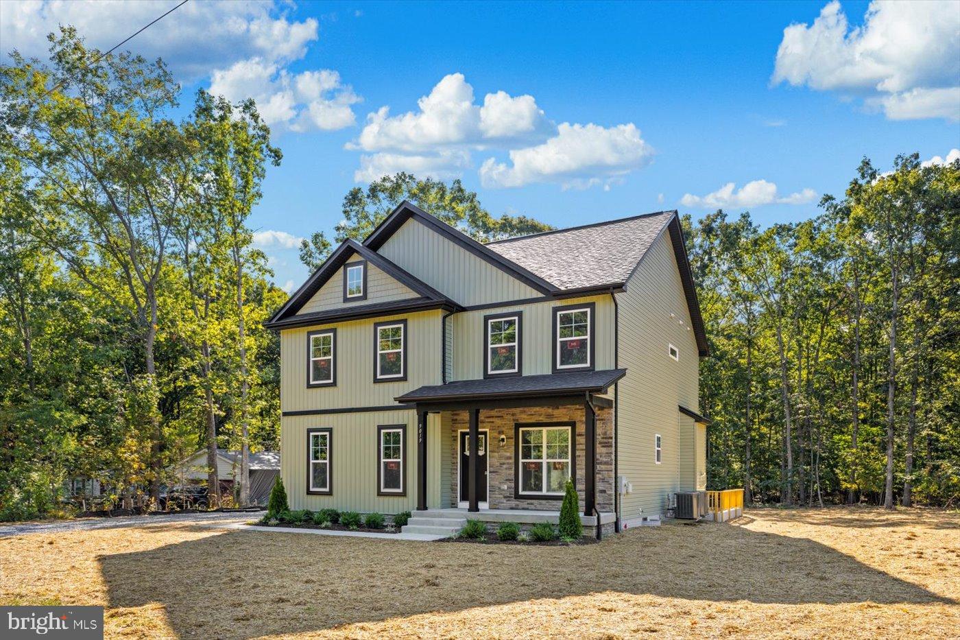 9019 Smiths Bend Road Fredericksburg, VA 22407 - Photo 49 of 57 front view of a house with a yard