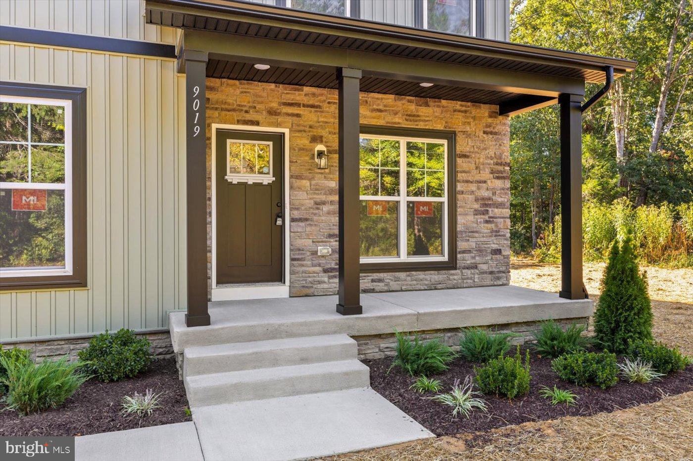 9019 Smiths Bend Road Fredericksburg, VA 22407 - Photo 50 of 57 a front view of a house with a yard