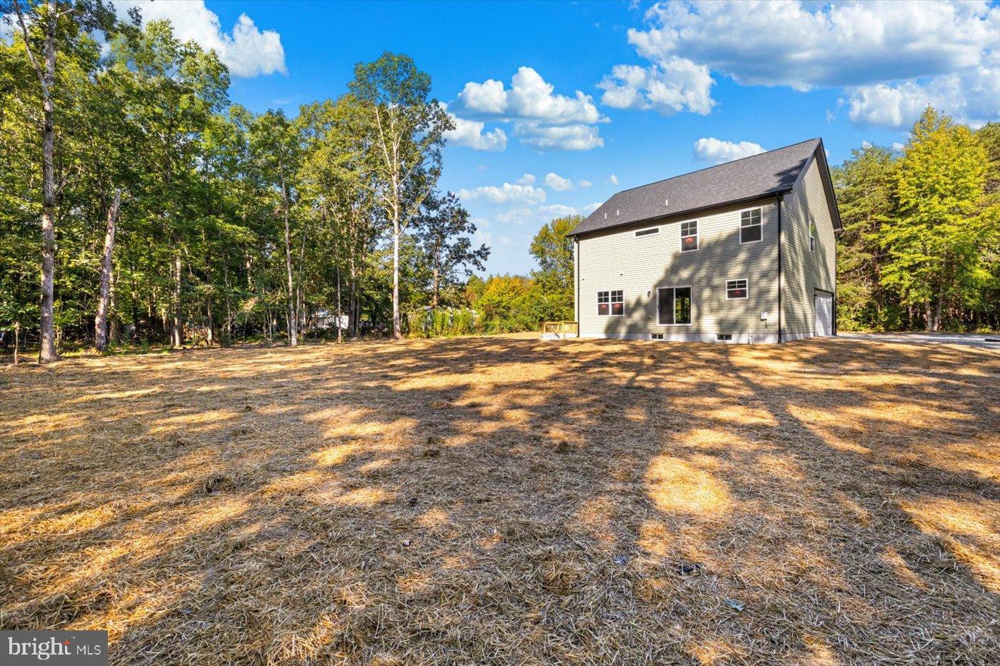 9019 Smiths Bend Road Fredericksburg, VA 22407 - Photo 54 of 57 a view of a house with a yard
